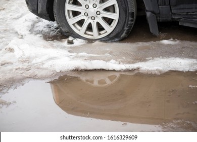 A Car With A Flat Tire, Outdoor Winter Shot