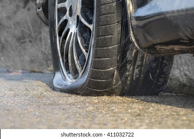 Car Flat Tire In Rainy Day