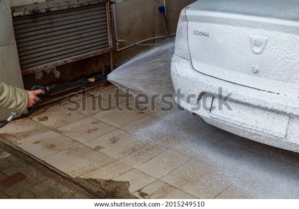 Car in foam at a self service car\
wash. April 9, 2021, Balti Moldova. Illustrative\
editorial
