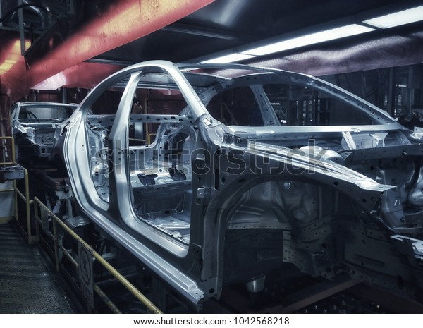Car frame structure on automobile manufacturing and\
transportation line