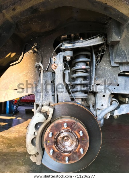Car front\
right disk brake after wheel\
removed