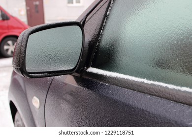 Car With Frosted Frost-covered Windows In Winter - Road Driving Safety, Ice Heating, Preparation For The Trip, Side View To Mirror