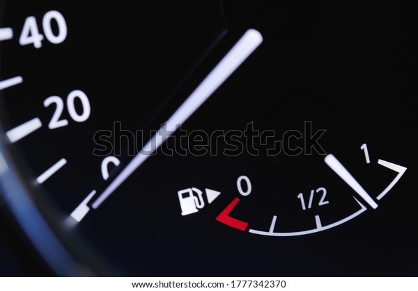 Car fuel indicator  illuminated with spped dial\
close up view