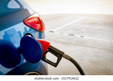 Car Fueling At Gas Station. Refuel Fill Up With Petrol Gasoline. Petrol Pump Filling Fuel Nozzle In Fuel Tank Of Car At Gas Station. Petrol Industry And Service. Petrol Price And Oil Crisis Concept.