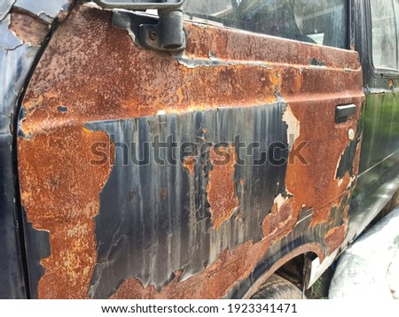 a car with full rust parked a long time