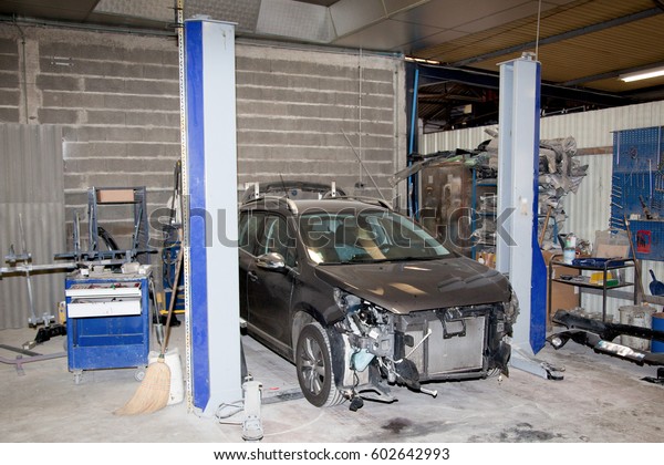 car is\
in the garage after an accident to be\
repaired