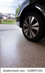 Car In Garage With Epoxy Floor Coating Over Concrete.