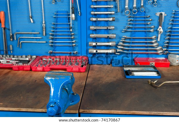 Car garage\
work bench with well organized\
tools