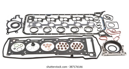 Car Gasket Set, cylinder head Separated. Crankshaft oil seal engine isolated on white background Auto Spare parts. A large set of gaskets for the engine of a passenger car. 