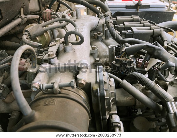 Car gasoline
engine photo. Car engine part. Close-up image, internal combustion
engine, used car, natural
light.