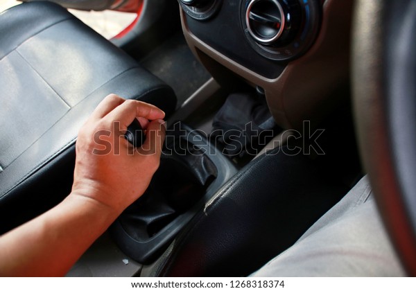 car gear stick on hand\
before driving.