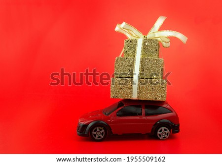 A car with a gift. Red background