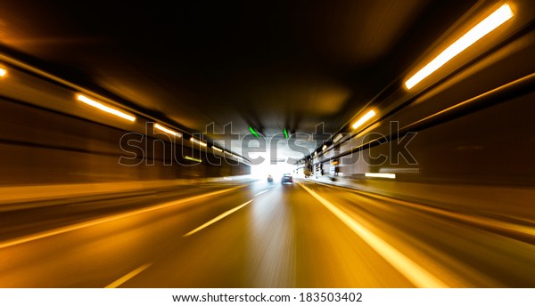 A car going\
full speed at the end of the\
tunnel