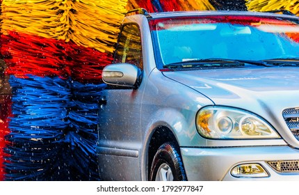 Car Going Through An Automated Car Wash Machine.