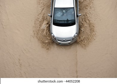 Car Going Through Flood Highway