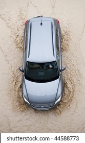 Car Going Through Flood Highway