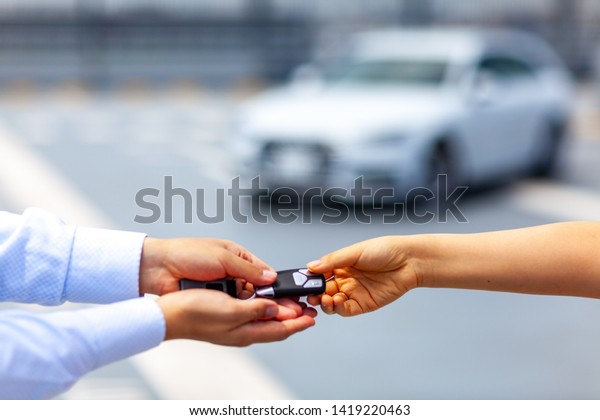 Car\
handling at dealer. Car share business\
image.