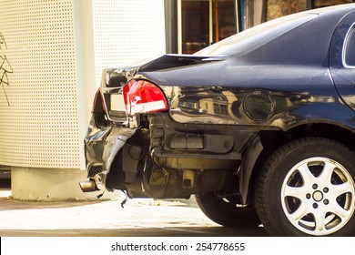 A Car Has A Dented Rear Bumper After An Accident