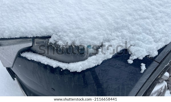 car headlight covered with\
snow