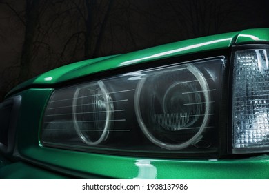 Car Headlight On Green Old Car At Night