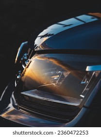 car headlight with sunrise reflection