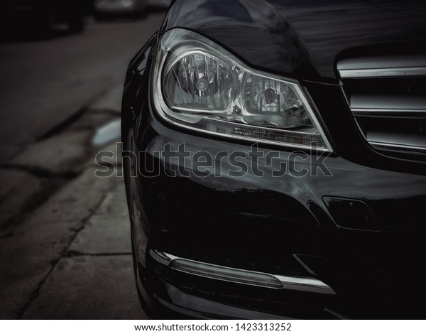 Car headlights,
black cars, dark background