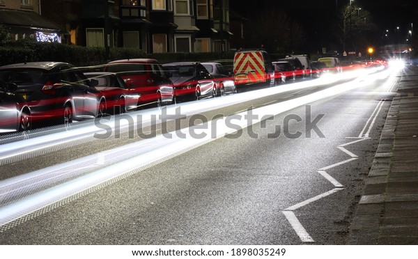 Car headlights on\
a busy street in Saltburn