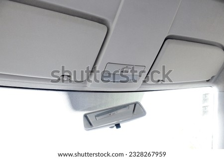 Car headliner. Sun visor auto. Rearview mirror. White Car ceiling