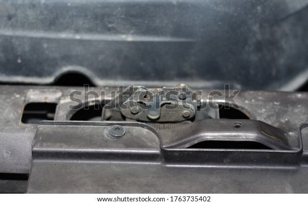 Car hood lock. Lock for opening and closing the hood\
on the car