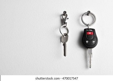 Car And House Keys Hanging On Wall