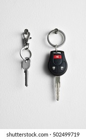 Car And House Keys Hanging On Wall