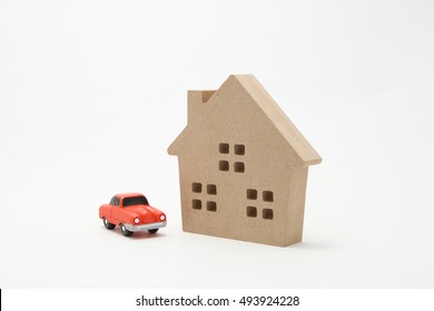 Car and house.
Miniature car and house on white background.