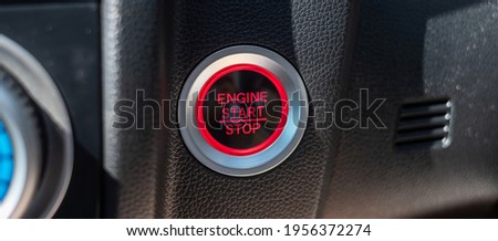 a car ignition button or START engine inside modern electric automobile. Keyless, change, strategy, vision, innovation and future concept