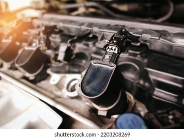 The car ignition coil electronic connector plug in the engine compartment has been removed, car repairing concept