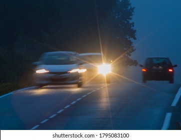 Car with incorrectly adjusted headlights starts to overtake motion blur