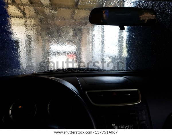 Car in industrial car\
wash, hygiene and cleaning of the cars at April 21, 2019 in\
Budapest, Hungary. 