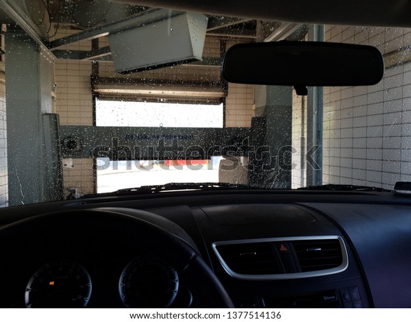Car in industrial car\
wash, hygiene and cleaning of the cars at April 21, 2019 in\
Budapest, Hungary. 