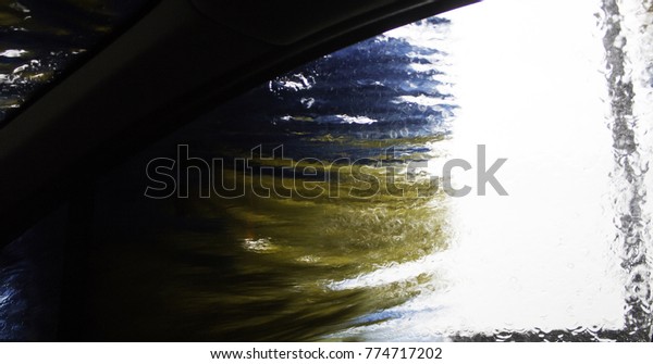 Car in industrial car wash, hygiene and cleaning
of vehicles