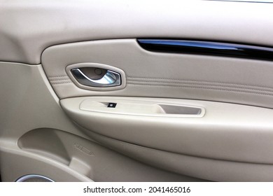 Car Inside Door Handle Interior. Door Trim. Window Lifters Control. Side Window Switch. Beige Car Interior. Clean Door Leather And Soft Touch Panel