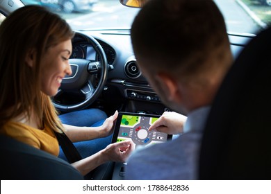 Car Instructor Teaching Student About Traffic Rules On Firs Automobile Driving Class.