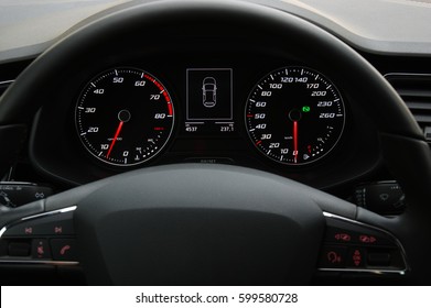Car instrument panel, dashboard closeup with visible speedometer