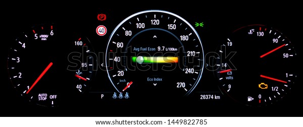 Car instrument panel with speedometer, tachometer,\
odometer, car\'s temperature gauge, malfunction check engine warning\
light control. Average fuel economy consumption display on car\
dashboard panel. 