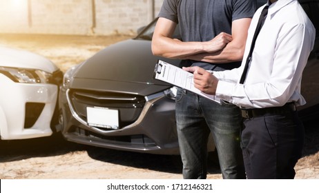 Car insurance agent writing on clipboard after assess the damage of accident and agree to care the cost of car repairs as conditions, Car insurance concept.
