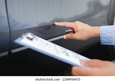 Car Insurance Agents Examine Damaged Car Inspecting Accident Claim On Car Paint And Body And Checklist Car Body Dent Point On Insurance Document For Repair Work In Body Paint Shop