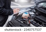 Car insurance, checklist and man writing on documents for compliance, maintenance and engine control. Vehicle, inspection and hand of male mechanic with paper form for information, note and claim