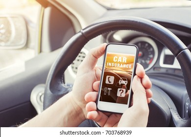 car insurance concept, driver reading website on smartphone