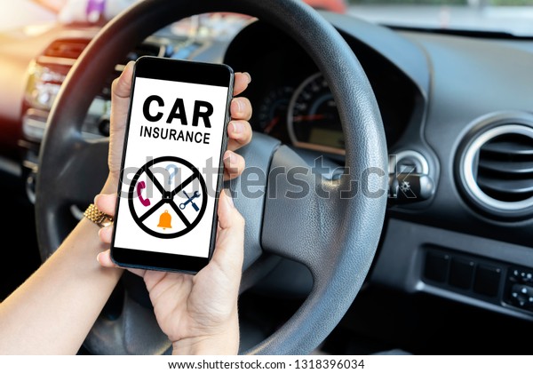 car insurance concept, driver reading website\
on smartphone. Women who need help from insurance companies, When\
having an accident.