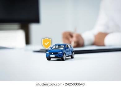 Car insurance, insurance concepts, finance, insurance business, guarantee, confidence, coverage, protection, and trust. Image of a person signing an insurance purchase contract - Powered by Shutterstock