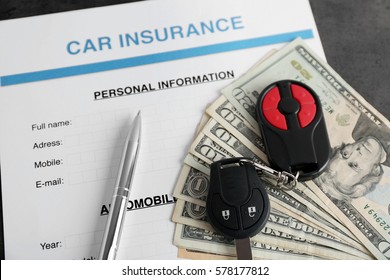 Car Insurance Form And Money On Table