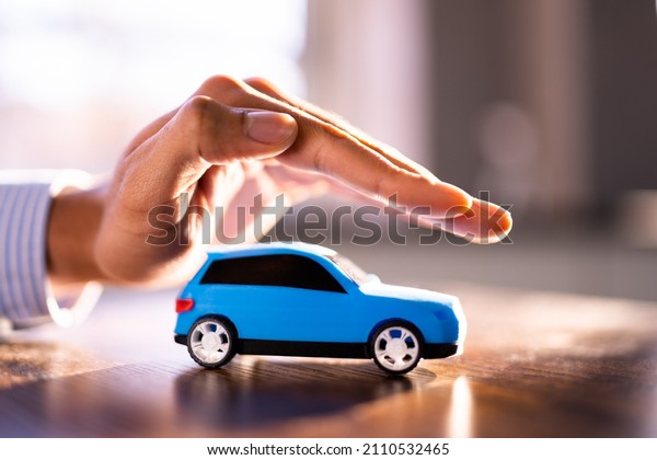 Car Insurance Guarantee. Safe Vehicle Concept.\
Secure Toy Auto